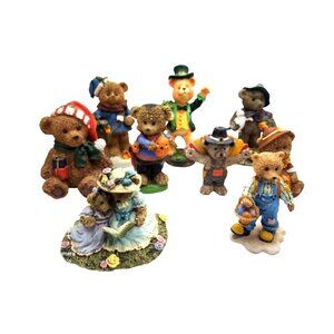 vintage set of 9 resin bears depicting holidays of the year.